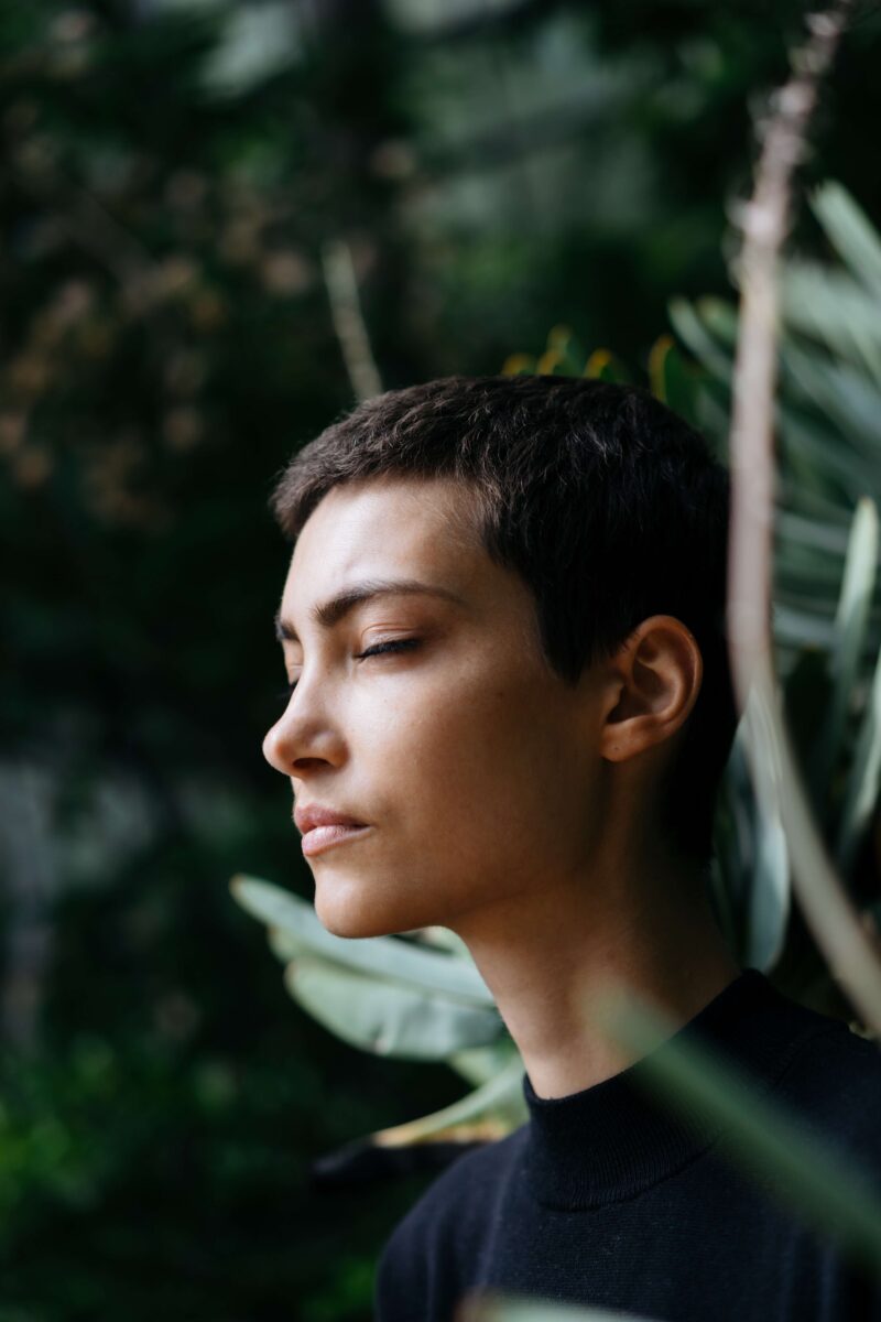 pensive person among greenery