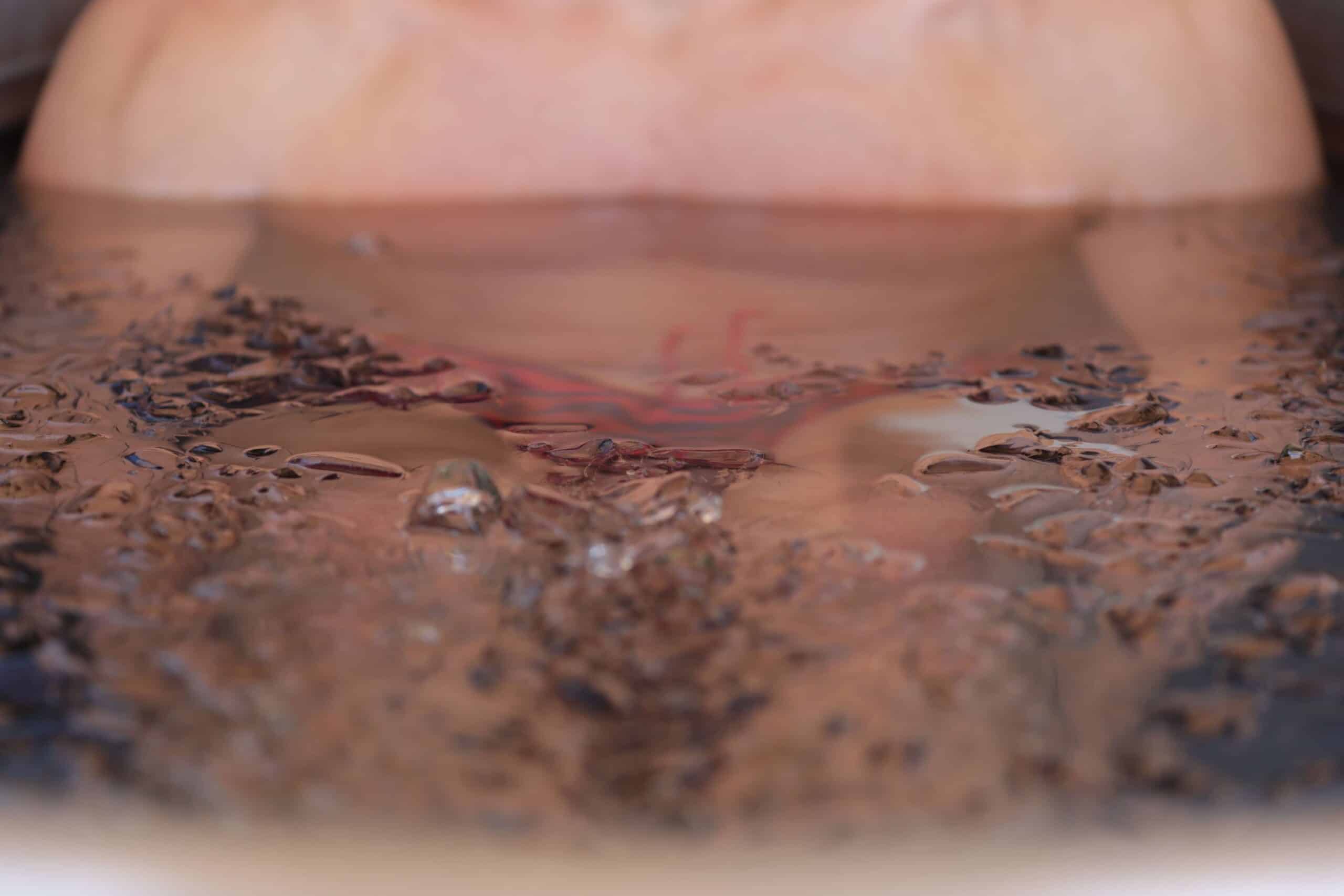 man's chest submerged in ice water